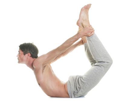 man doing yoga in front of white background