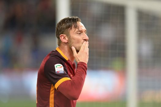 ITALY, Rome: Francesco Totti of AS Roma celebrates after scoring the team's third goal from penalty spot during the Serie A match between AS Roma and Torino FC at Stadio Olimpico on April 20, 2016 in Rome, Italy. 