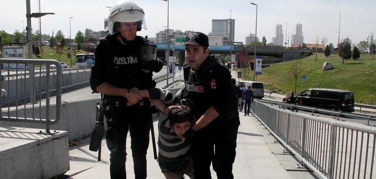 TURKEY, Istanbul: Policemen arrest a protester outside the courthouse in Istanbul, Turkey, on April 20, 2016, during the second hearing in the trial of a police officer accused of killing Dilek Doğan. Dogan died after being shot dead during a police raid of her family's house in Istanbul's Sariyer district, last October. Dozens of protesters, who shouted Murderers of Dilek must be tried, has been taken into custody by police. 