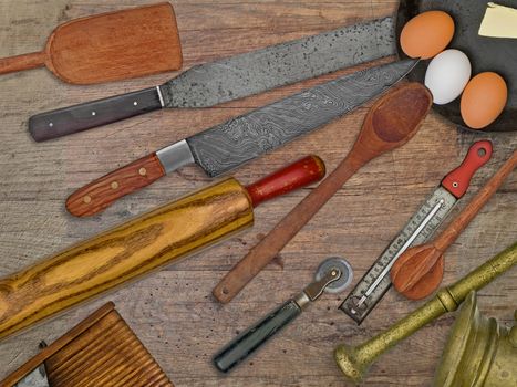 vintage bakery shop tools and utensils over stained wooden table