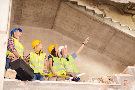 Four construction architects in building damaged in the disaster.