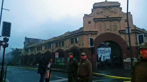 CHILE, Temuco: The municipal market of Temuco in the Cautin province, southern Chile, is seen on the morning of April 21, 2016, after being destroyed by a massive fire during the night. At least two firefighters have been injured as over 400 people worked to evacuate nearby residents.