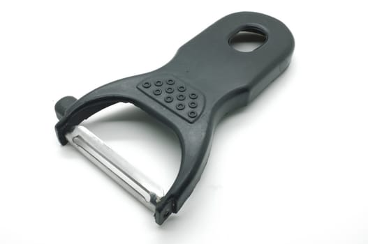Black peeler isolated on white background