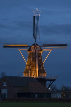 Authentic renovated windmill in Winterswijk in the east of the Netherlands in special illumination
