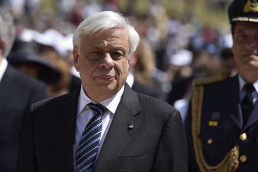 GREECE, Olympia: Greece's President Prokópis Pavlópoulos attends the lightning ceremony of the Olympic flame at the Temple of Hera on April 21, 2016 in ancient Olympia, the sanctuary where the Olympic Games were born in 776 BC. The Olympic flame was lit  in an ancient temple in one country in crisis and solemnly sent off carrying international hopes that Brazil's political paralysis will not taint the Rio Games that start in barely 100 days. 