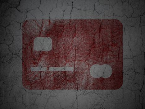 Currency concept: Red Credit Card on grunge textured concrete wall background