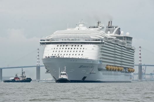 FRANCE, Saint-Nazaire: The Harmony of the Seas cruise ship leaves the STX shipyard of Saint-Nazaire, western France, for its second sea trial, on April 21, 2016. With a capacity of 6.296 passengers and 2.384 crew members, the Harmony of the Seas, built by STX France for the Royal Caribbean International, is the world's largest ship cruise.