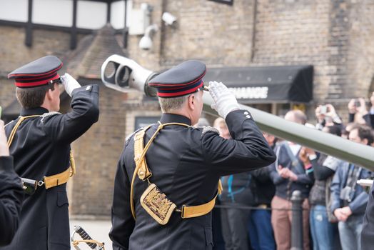 UK, London: Members of The Honourable Artillery Company salute during a 62 gun salute in London for  Queen Elizabeth II 90th birthday on April 21, 2016.Thousands of spectators lined the river for the ceremony. The Queen is the longest reigning monarch in British history. 