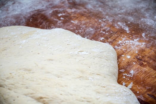 close up of prepared dough on the wood table