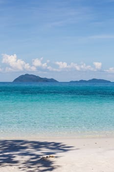 white sand and blue sky on beautiful beach