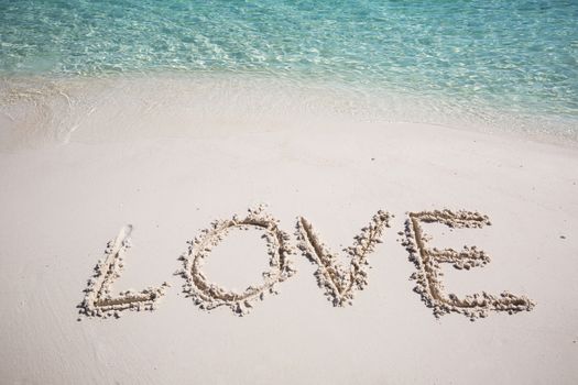 write wording love on the beach