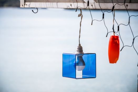 creative bulb lamp hanging on crossbeam