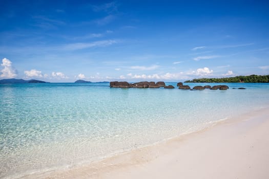 white sand and blue sky on beautiful beach