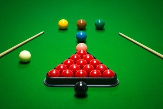 snooker balls set on a green table