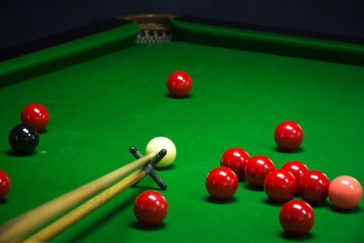 snooker balls set on a green table