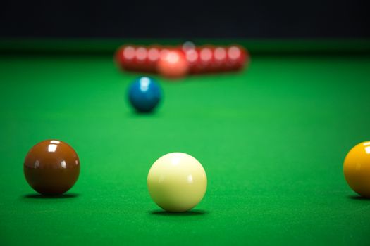 snooker balls set on a green table