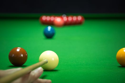 snooker balls set on a green table