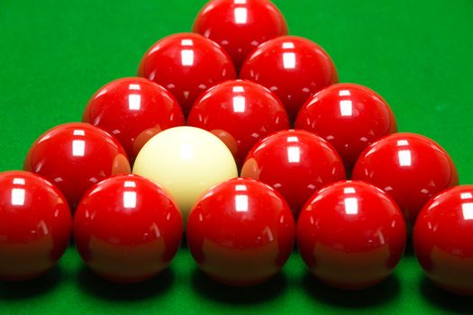 snooker balls set on a green table