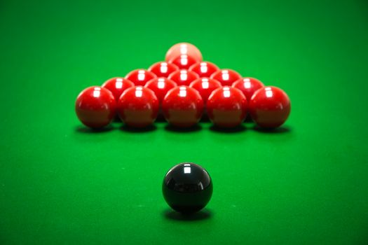 snooker balls set on a green table