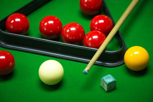 snooker balls set on a green table