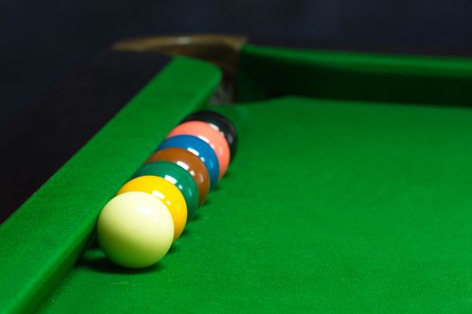 snooker balls set on a green table