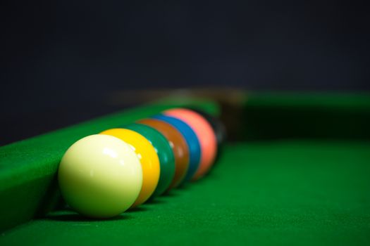 snooker balls set on a green table