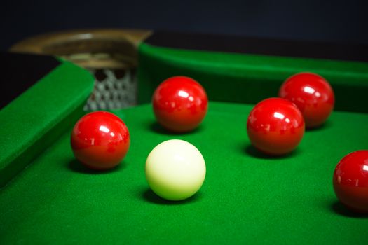 snooker balls set on a green table