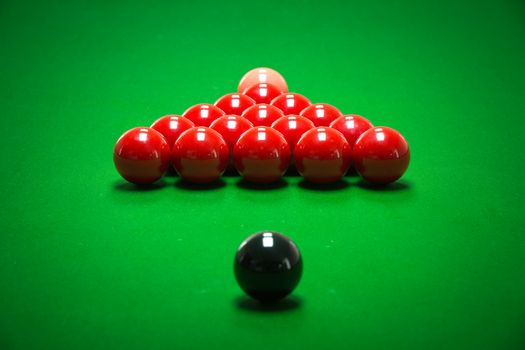 snooker balls set on a green table