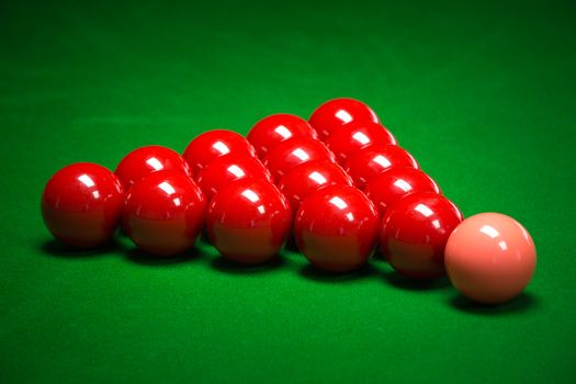 snooker balls set on a green table