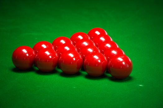 snooker balls set on a green table