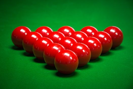 snooker balls set on a green table