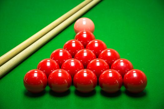 snooker balls set on a green table