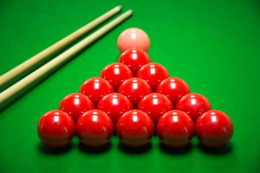 snooker balls set on a green table