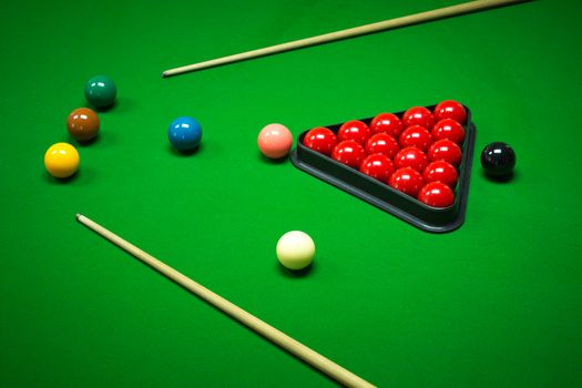 snooker balls set on a green table