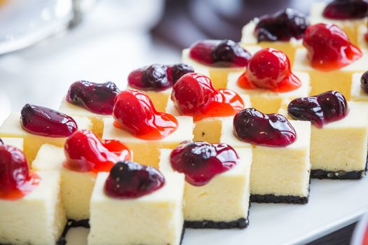 close up of strawberry and blueberry cheesecake