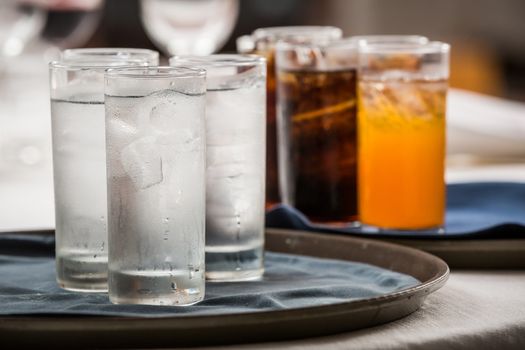 many soft drink are on a tray