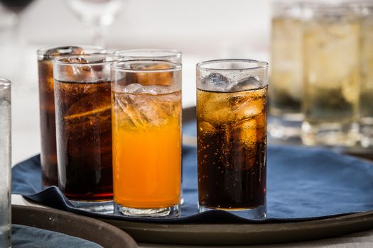 many soft drink are on a tray