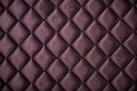 close up of silk burgundy sofa