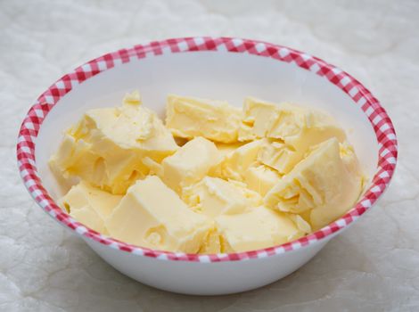 cloe up of yellw butter in bowl