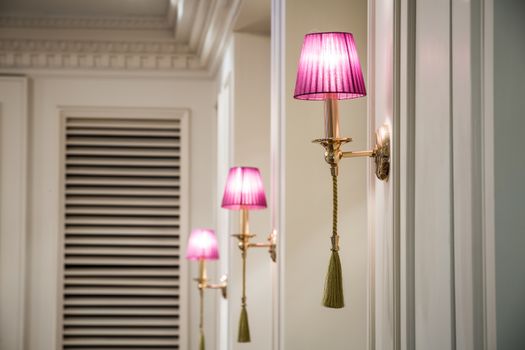 pink lamp on the wall