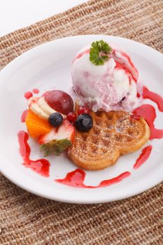 blueberry yogurt ice cream serve with waffle and mix fruit