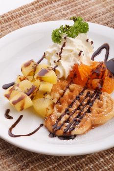 heart waffle serve with golden kiwi and orange