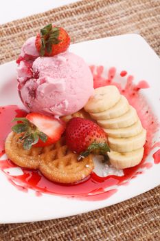 vaniila waffle with strawberry ice cream and banana