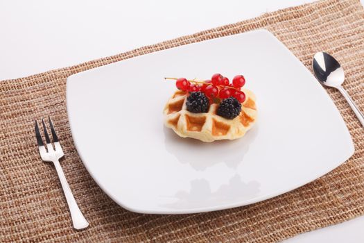 vaniila waffle with mix berry for breakfast