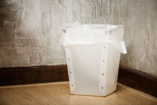 white plastic bin in room