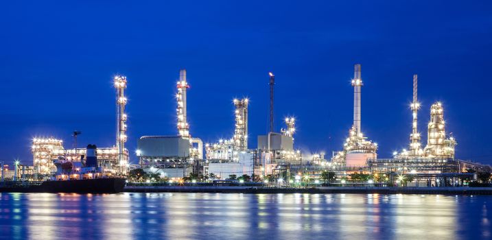 Oil refinery and blue sky near a river at thailand