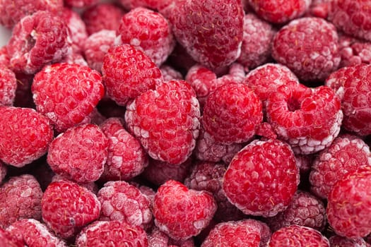 a lot of red freezed raspberries