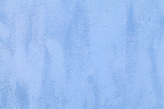 background of a blue wall outside of a home