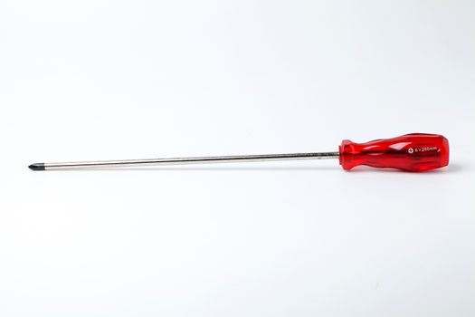 screwdriver with red grasp on white background