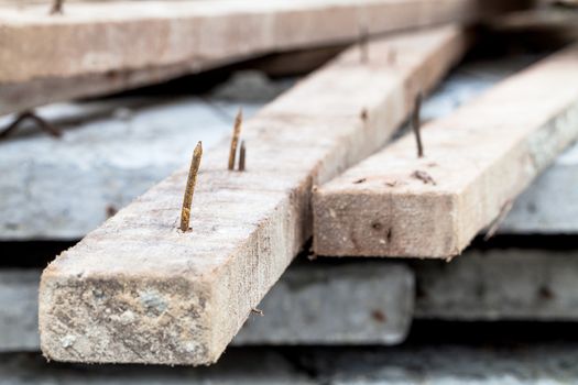 sharp rusty nail stick on wood